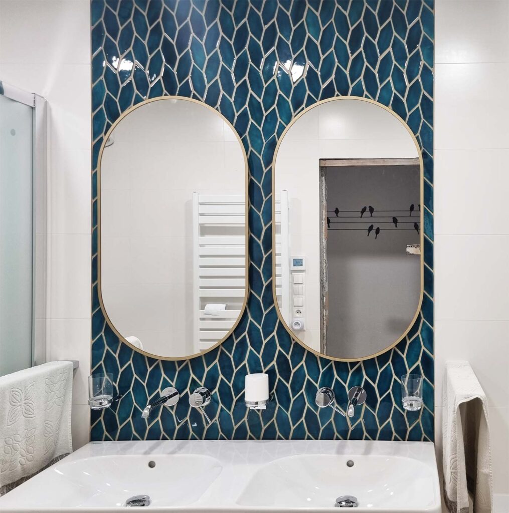 Ceramic mosaic tiles - longed hexagons, petrol blue color, bathroom wall behind the mirror